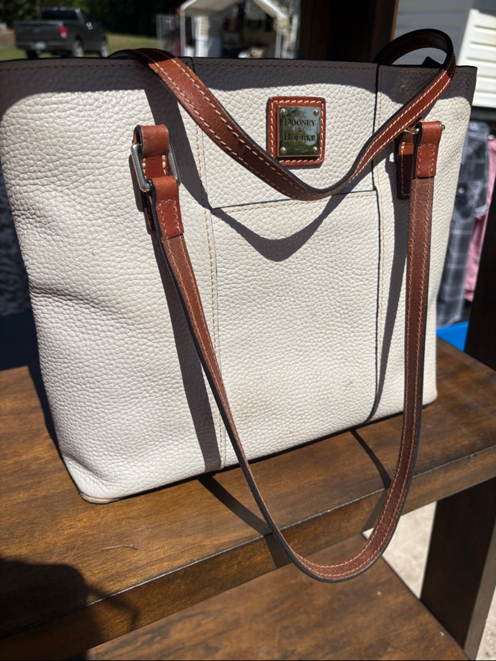 Dooney & Bourke Cream Leather Tote with Brown Trim and Plaque